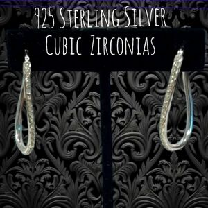 Sparkling Cubic Zirconias Oval Hoops with a Twist 925 Sterling Silver 1"